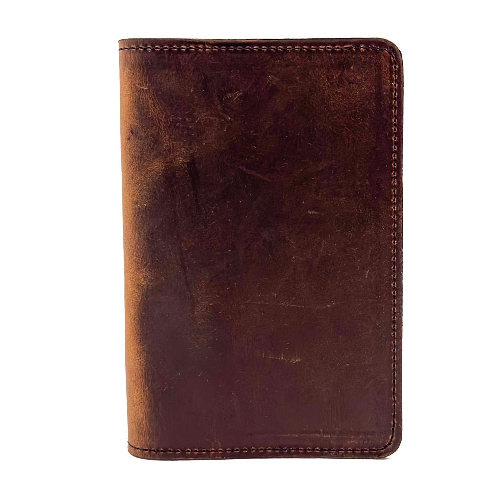 Hard Times Pocket notebook cover in a model's hand